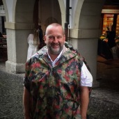 Smiling in the rain (in a Swiss army poncho!)